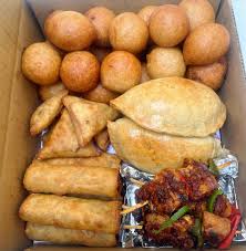 2 puff puff, 1 meatpie, 1 spring roll, 1 samosa, and 1 chicken $8.50